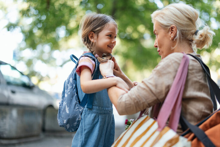 Mother Preparing Daughter for School